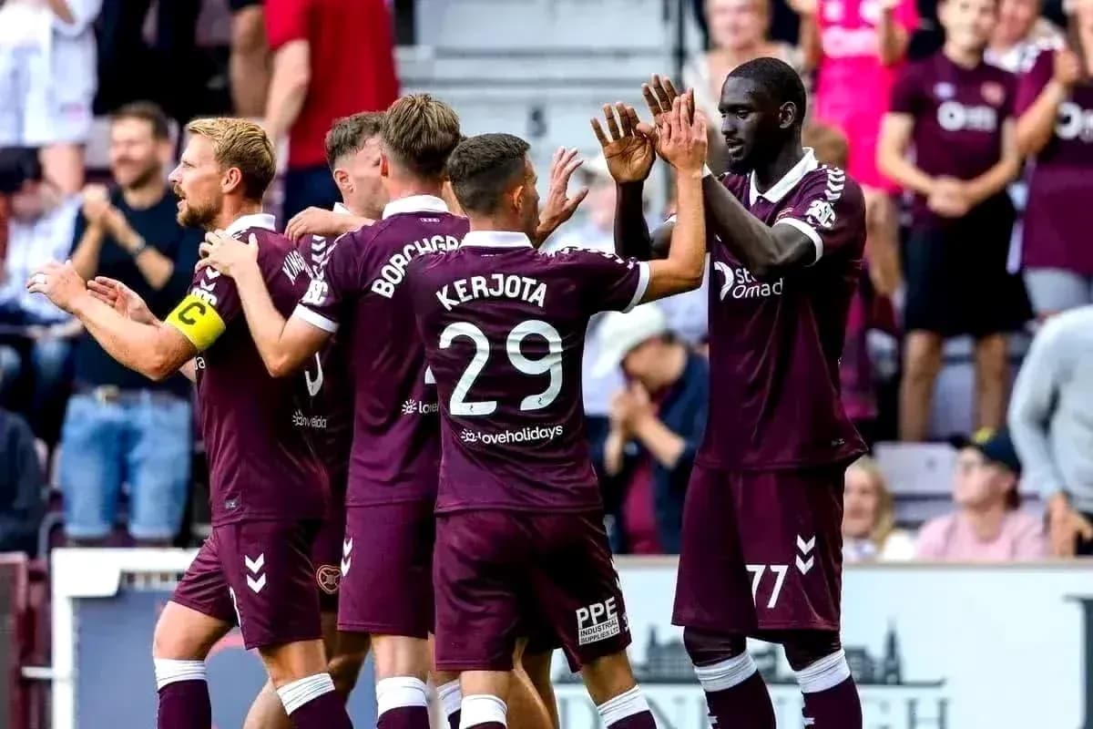Heart Of Midlothian players celebrating together Heart Of Midlothian players celebrating together