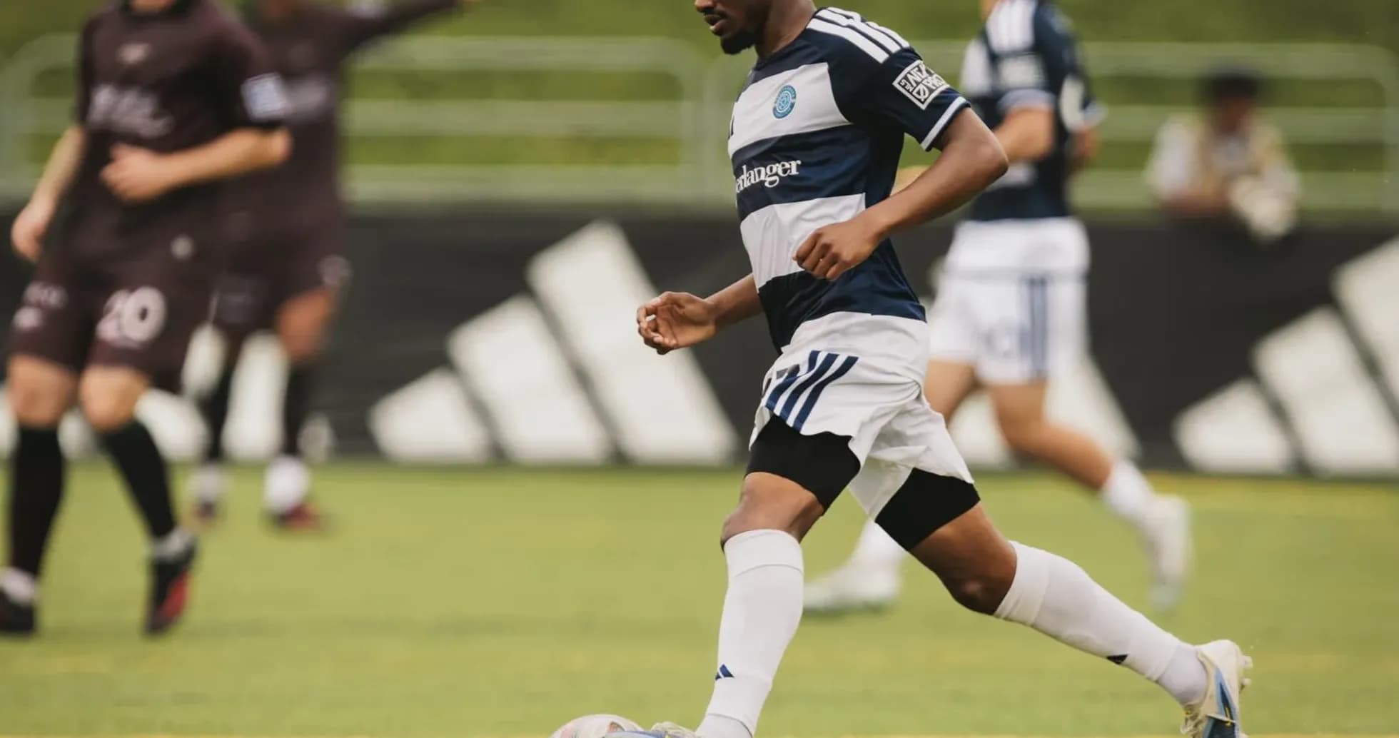 Player dribbling the ball during MLS Next Pro match Player dribbling the ball during MLS Next Pro match