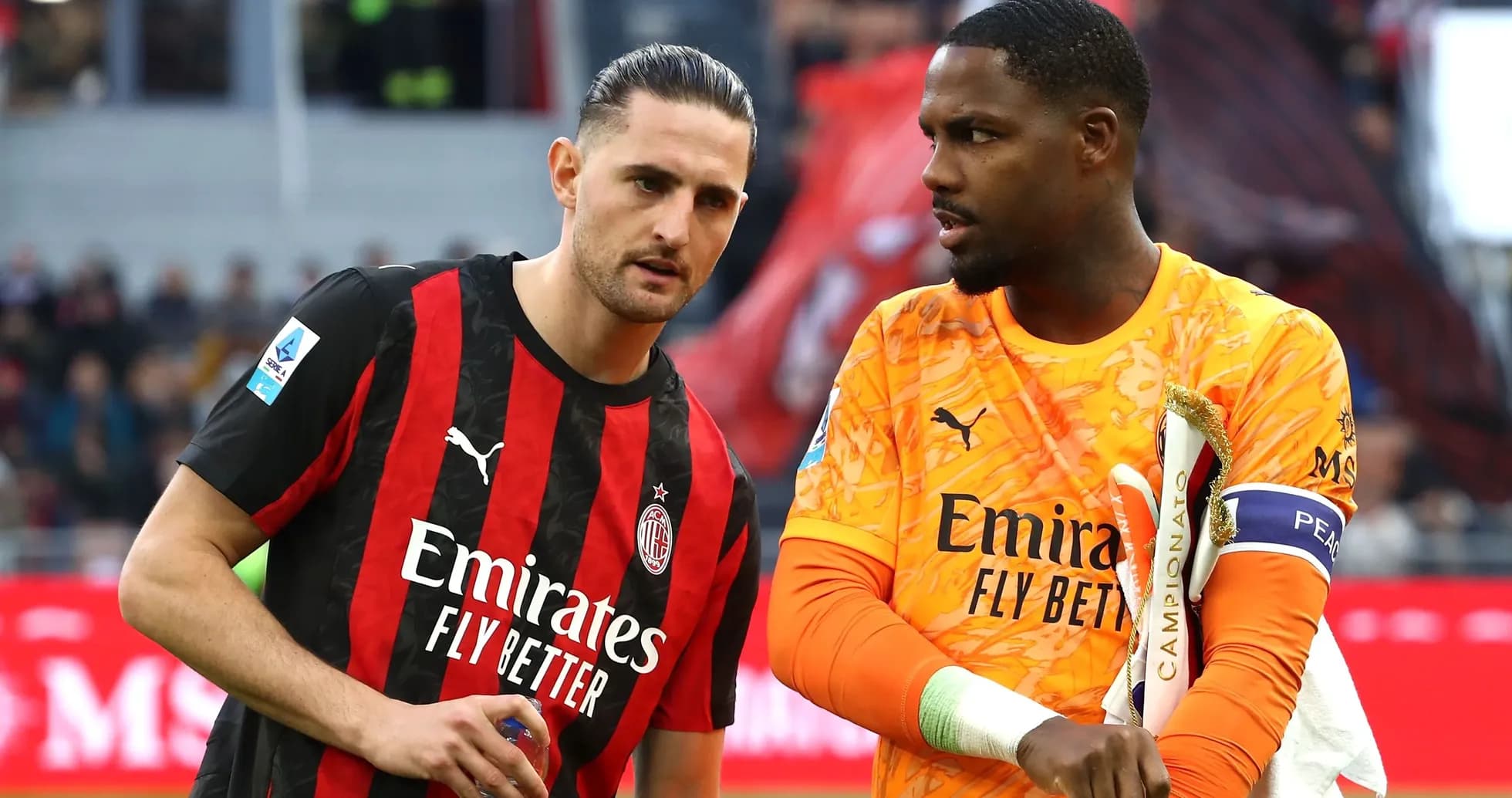 Two AC Milan players discussing on the pitch Two AC Milan players discussing on the pitch
