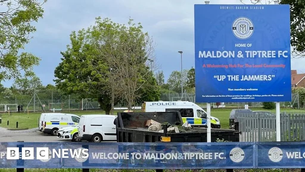 Sign for Maldon & Tiptree FC at stadium entrance Sign for Maldon & Tiptree FC at stadium entrance