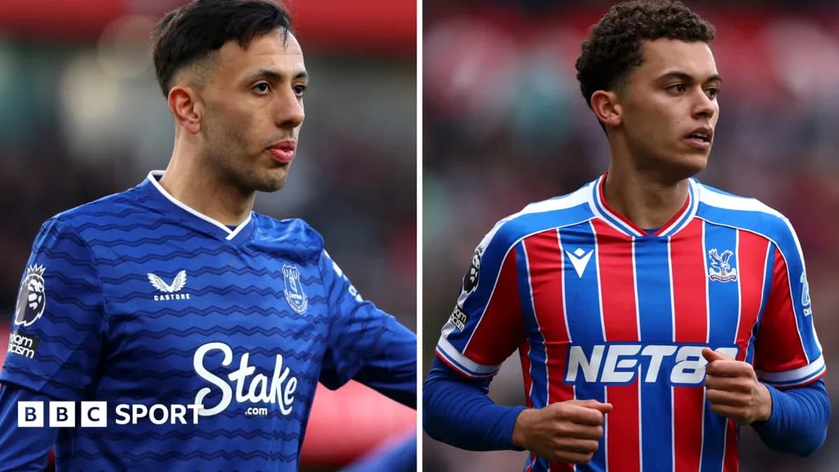 Two football players in club jerseys on the pitch Two football players in club jerseys on the pitch