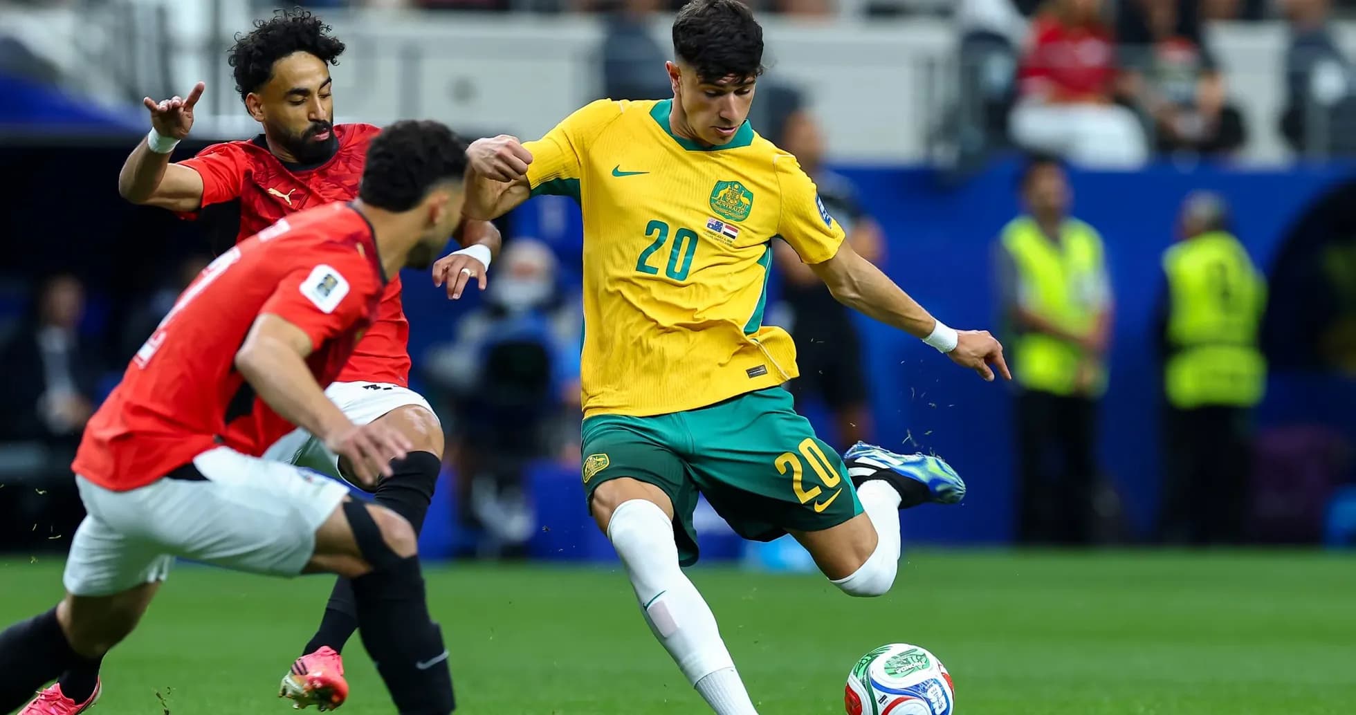 Player from Australia dribbling the ball against Egypt Player from Australia dribbling the ball against Egypt