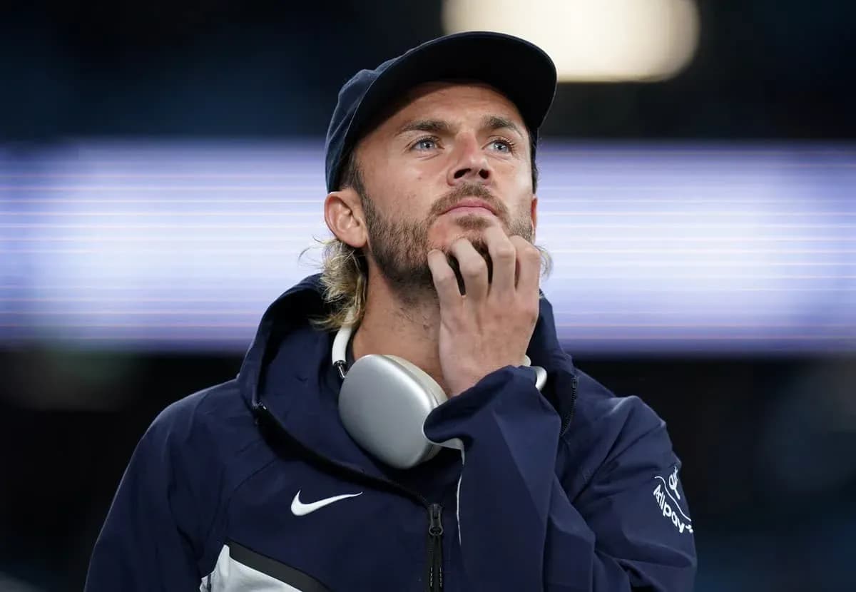 Man in sportswear looking thoughtfully at the field Man in sportswear looking thoughtfully at the field