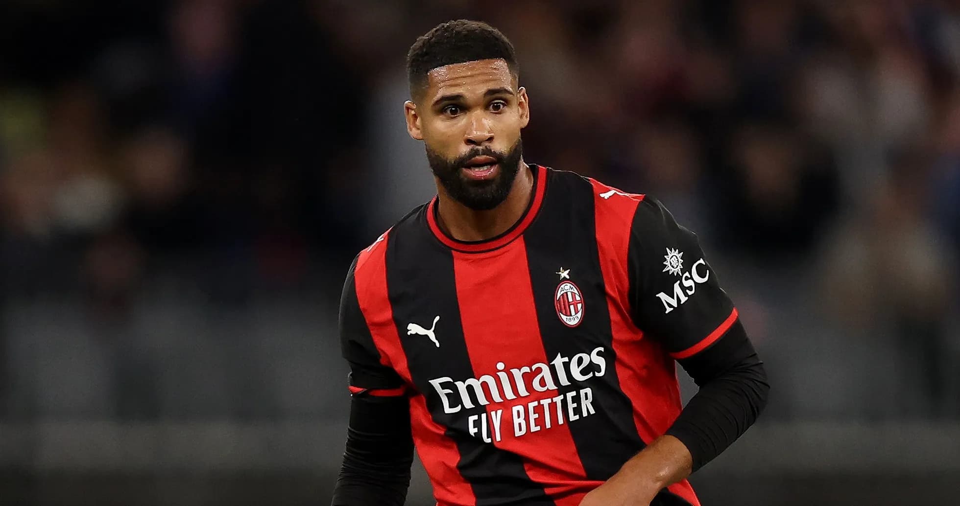 Player in AC Milan jersey during match action Player in AC Milan jersey during match action