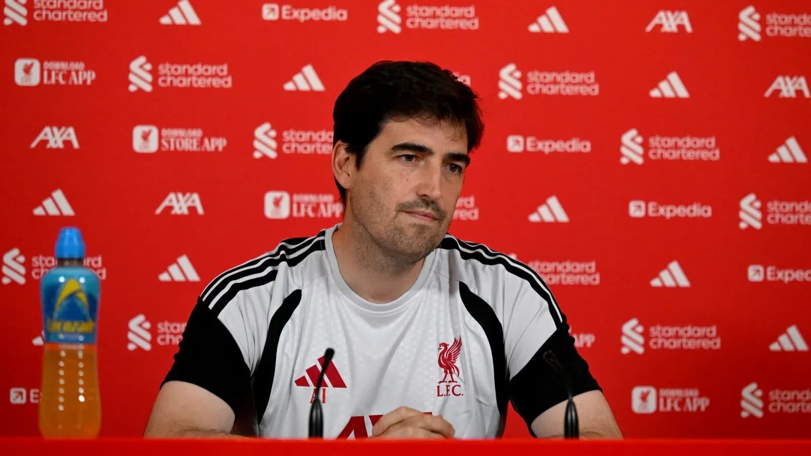 Coach speaking at Liverpool FC press conference Coach speaking at Liverpool FC press conference