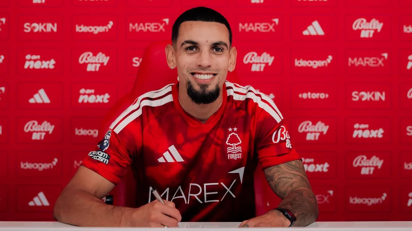 Player signing contract at Nottingham Forest press conference Player signing contract at Nottingham Forest press conference