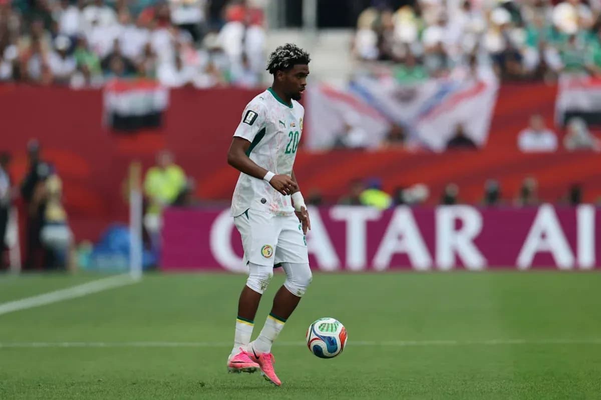 Player in Senegal kit controlling the soccer ball Player in Senegal kit controlling the soccer ball