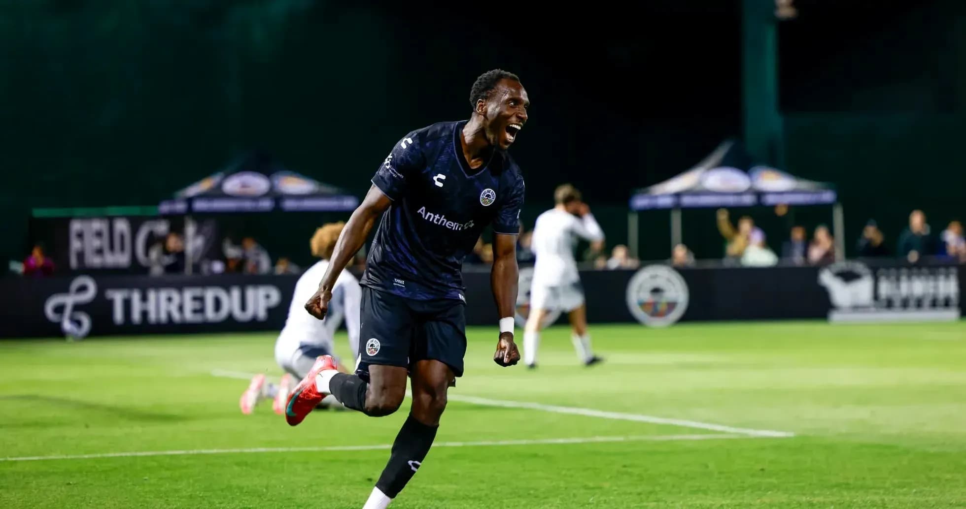 Player celebrating after scoring a goal Player celebrating after scoring a goal