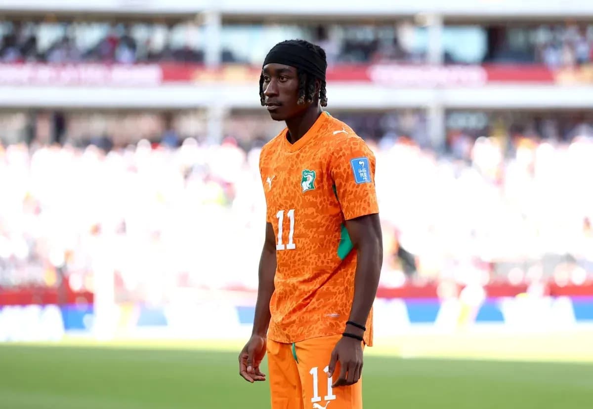 Player in orange jersey during a match Player in orange jersey during a match