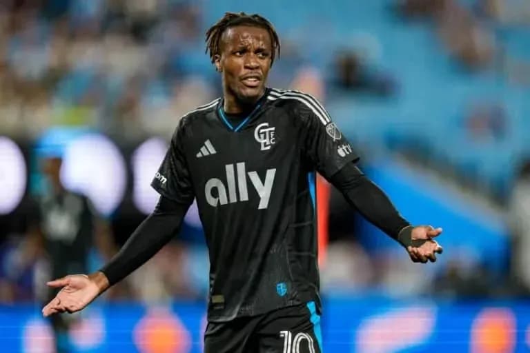 Player in black jersey gesturing during match Player in black jersey gesturing during match