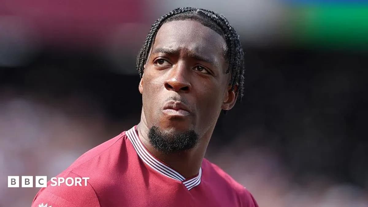 Player wearing maroon jersey during match warm-up Player wearing maroon jersey during match warm-up