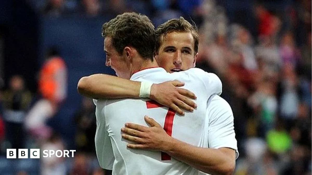 Two players embracing during a football match Two players embracing during a football match
