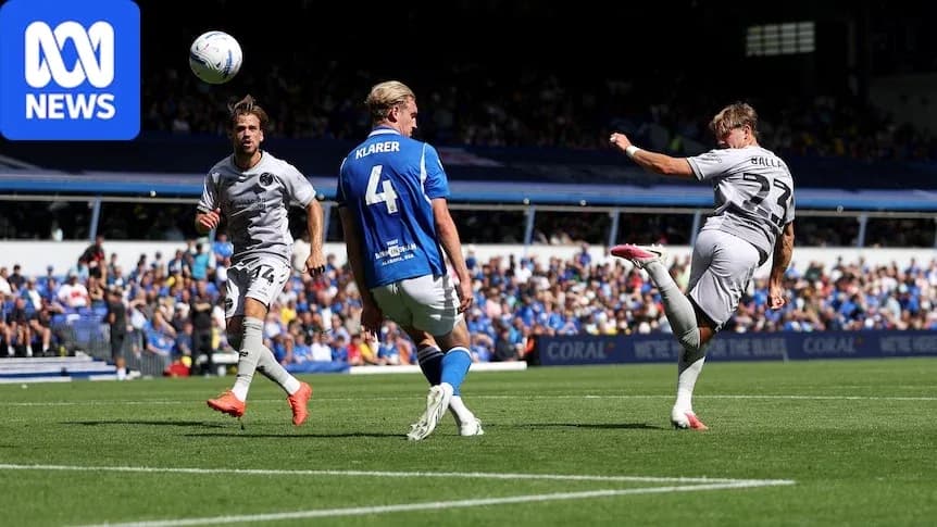 Player kicking ball during a football match Player kicking ball during a football match