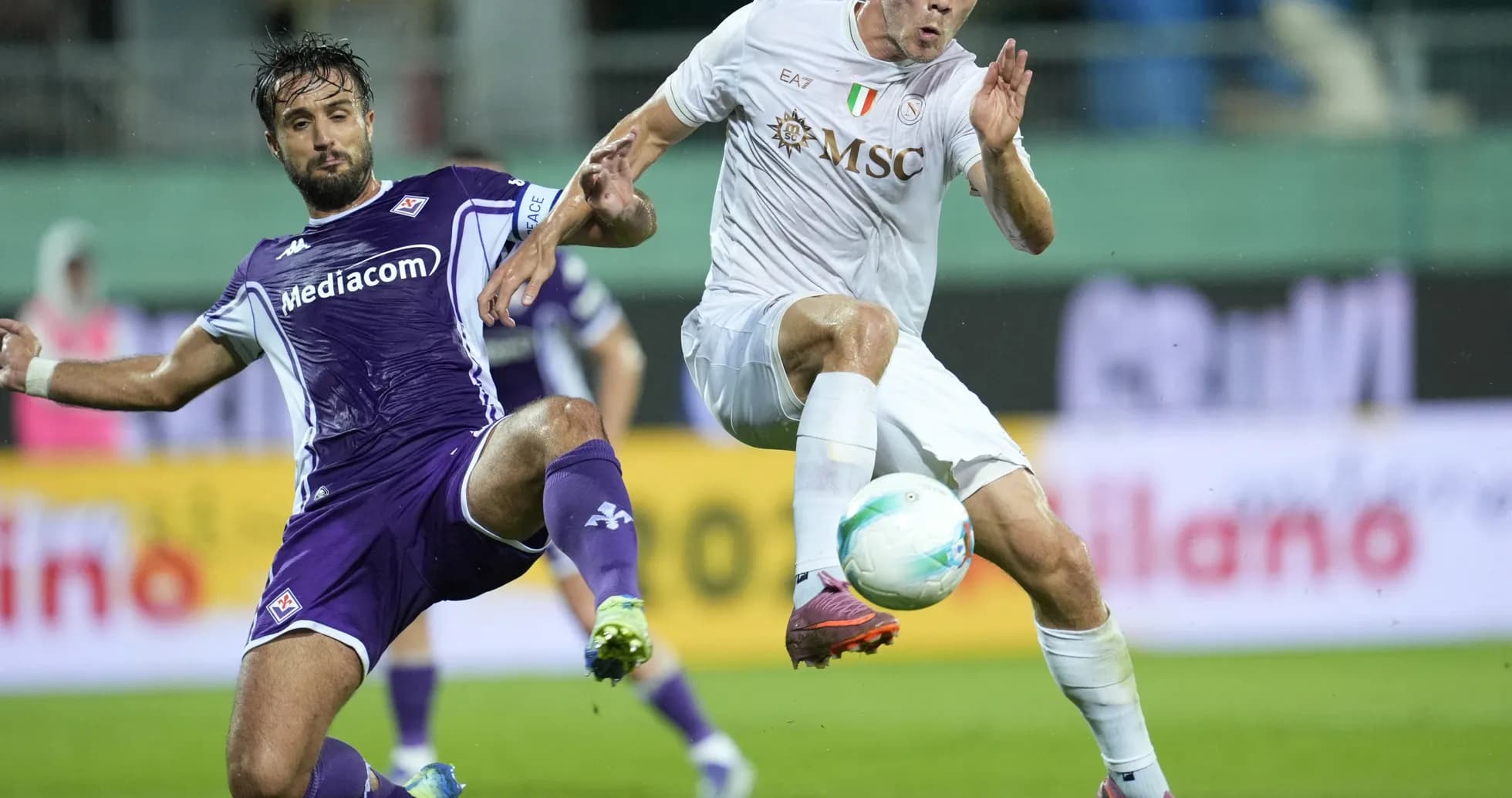 Fiorentina player challenges Napoli opponent for ball Fiorentina player challenges Napoli opponent for ball
