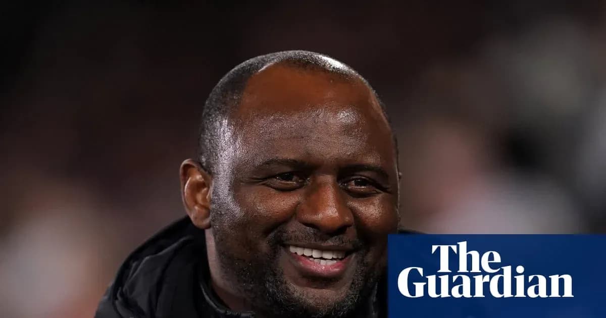 Smiling coach on sidelines during a match Smiling coach on sidelines during a match
