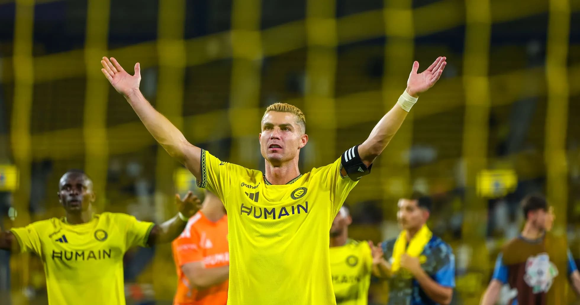 Player celebrating with arms raised after match Player celebrating with arms raised after match