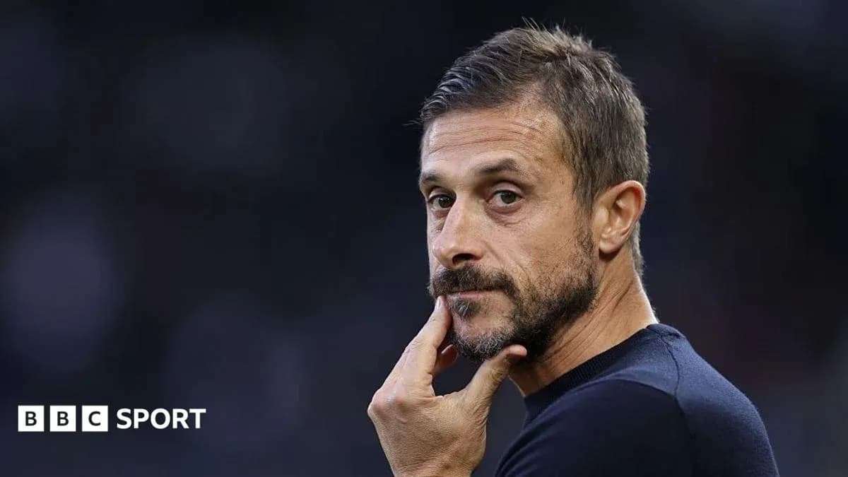 Coach pondering during match, hand on chin Coach pondering during match, hand on chin
