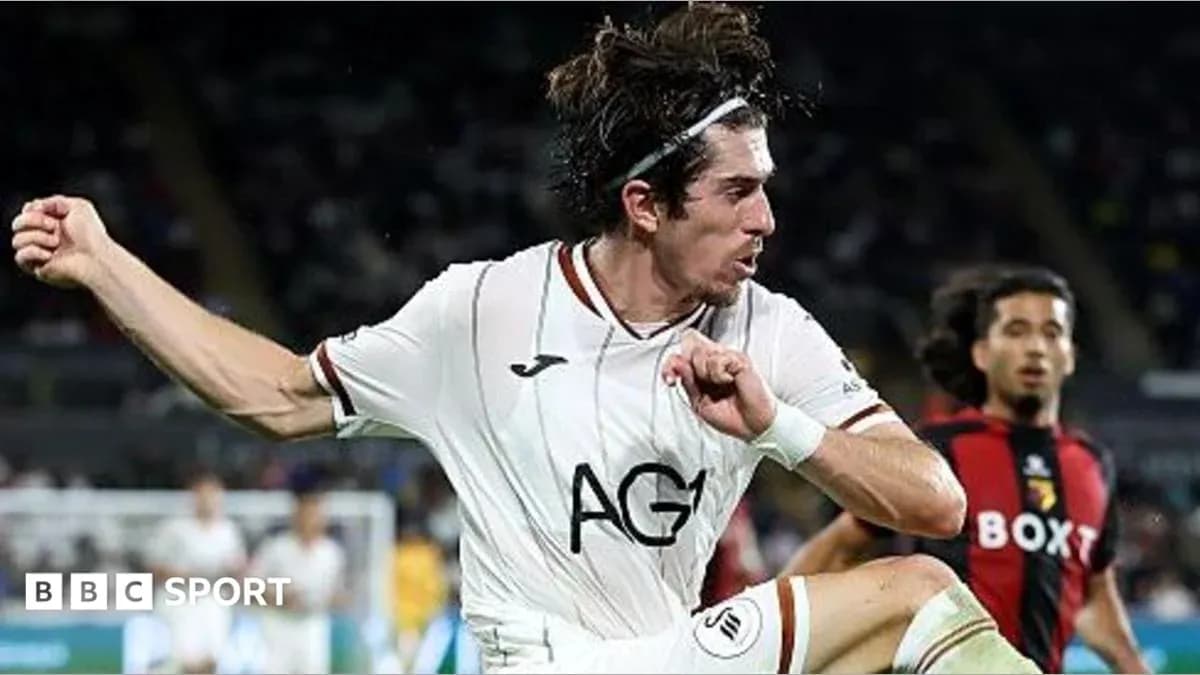 Player kicking the ball during a football match Player kicking the ball during a football match