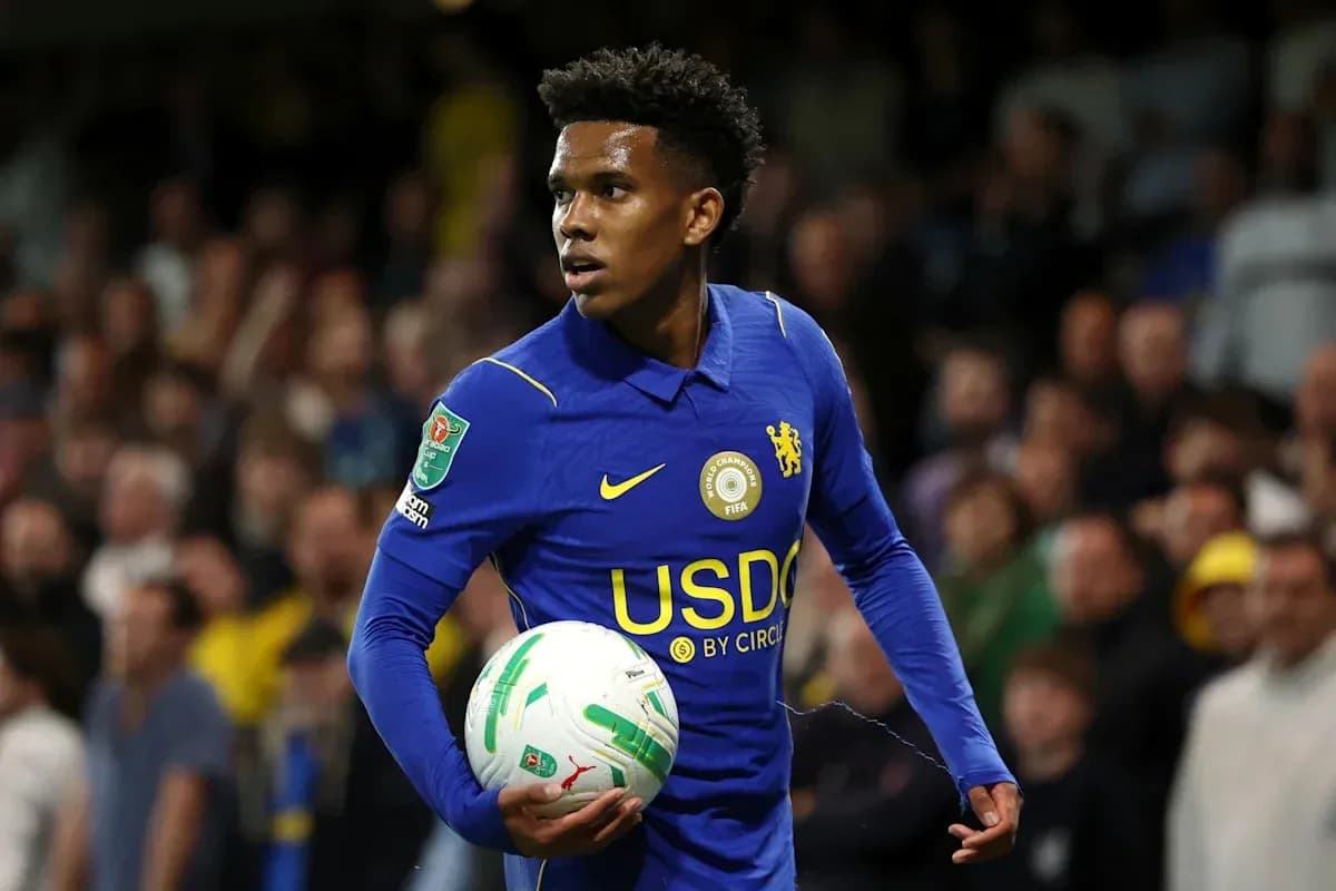 Player in blue kit holding ball during match Player in blue kit holding ball during match