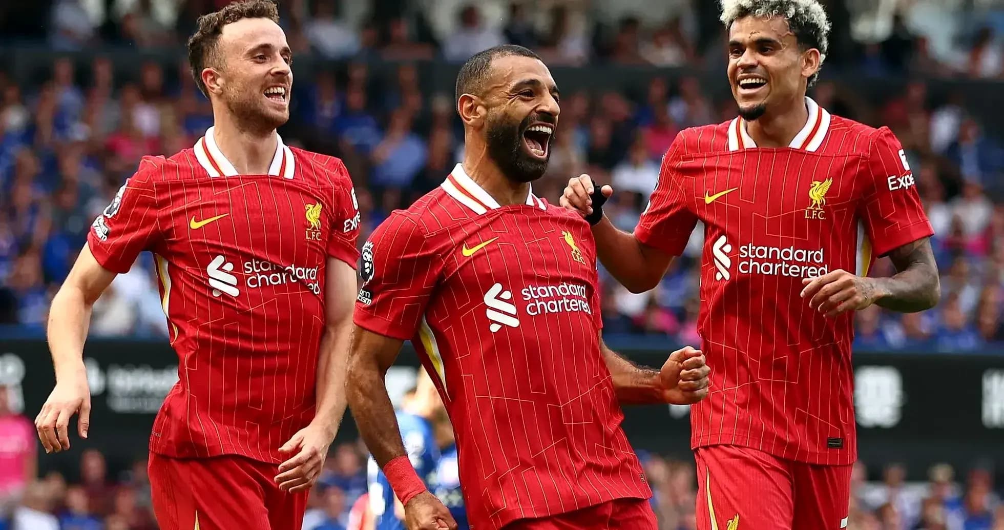 Liverpool players celebrating a goal during match Liverpool players celebrating a goal during match