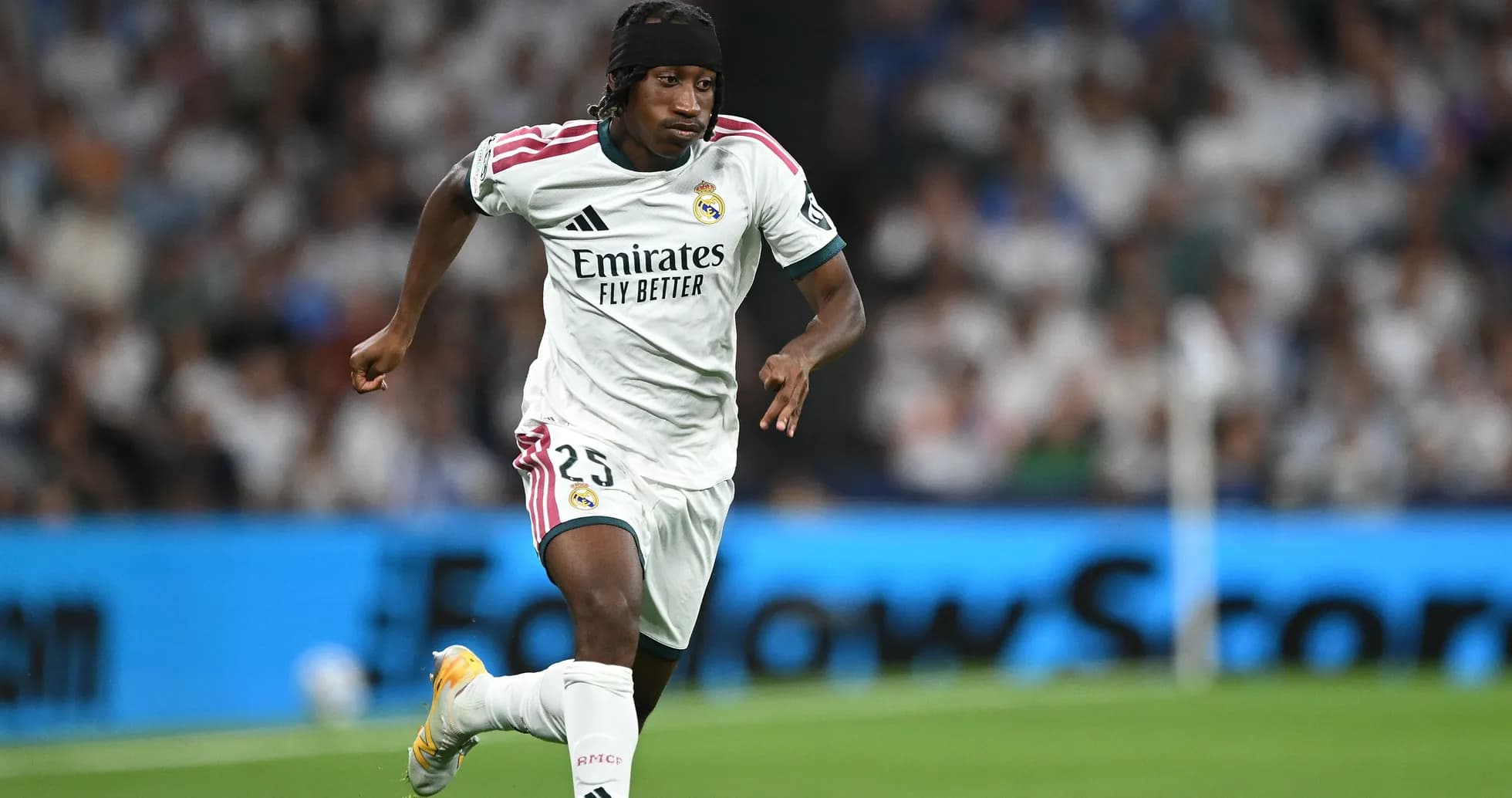 Player running with ball during Real Madrid match Player running with ball during Real Madrid match
