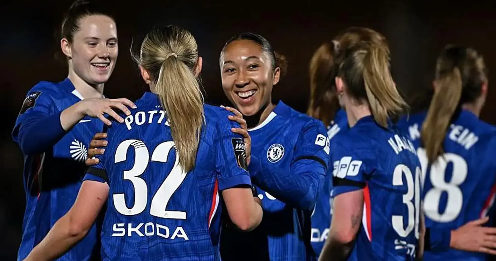 Chelsea Women discussing strategy during a match. Chelsea Women discussing strategy during a match.