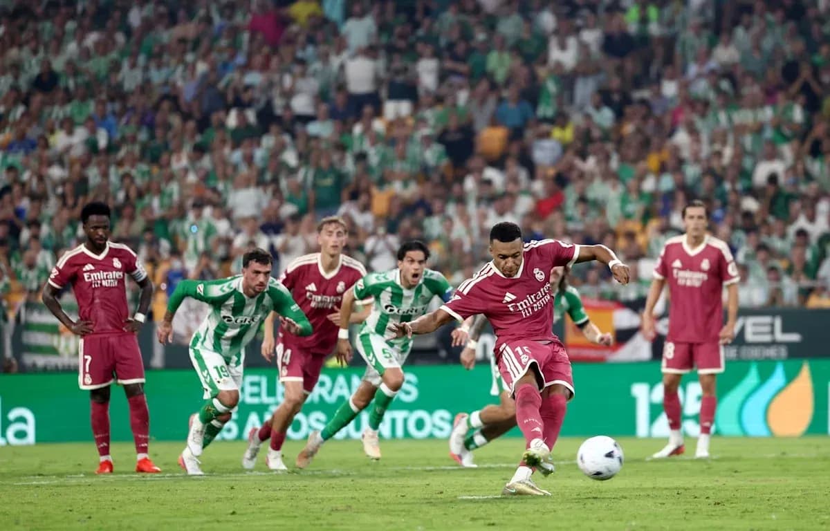 Player taking a penalty kick during football match Player taking a penalty kick during football match