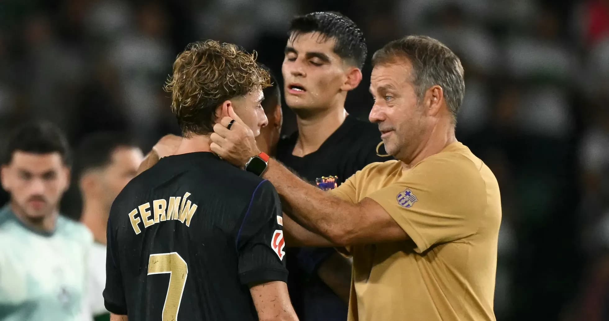 Coach speaking to player after match on field Coach speaking to player after match on field