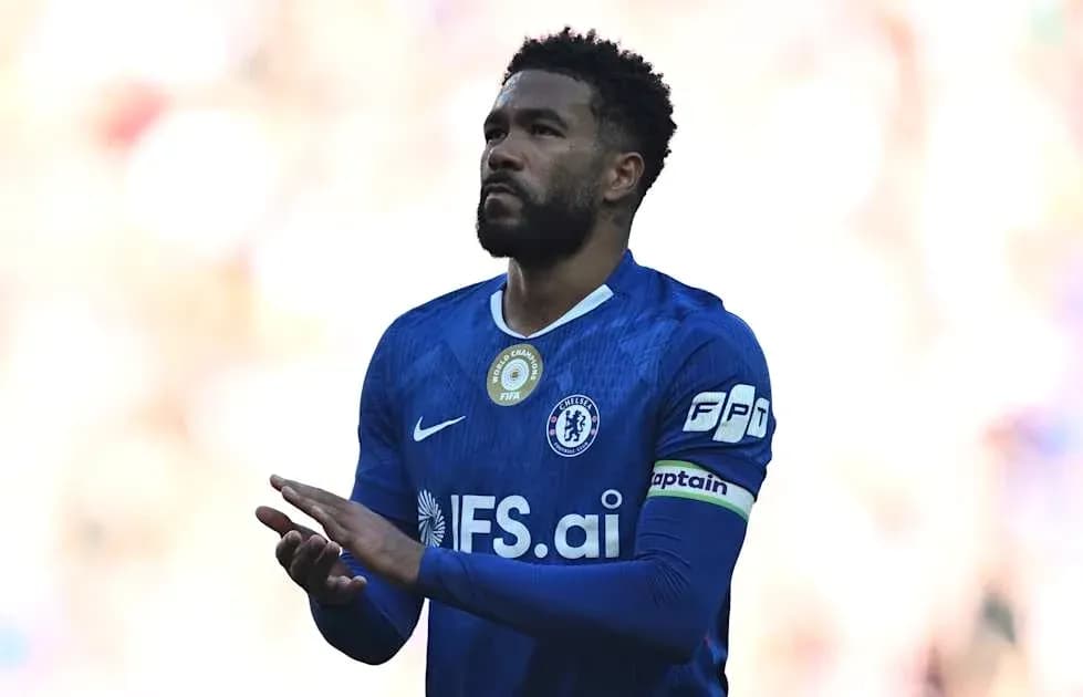 Player in blue jersey applauding fans during match Player in blue jersey applauding fans during match