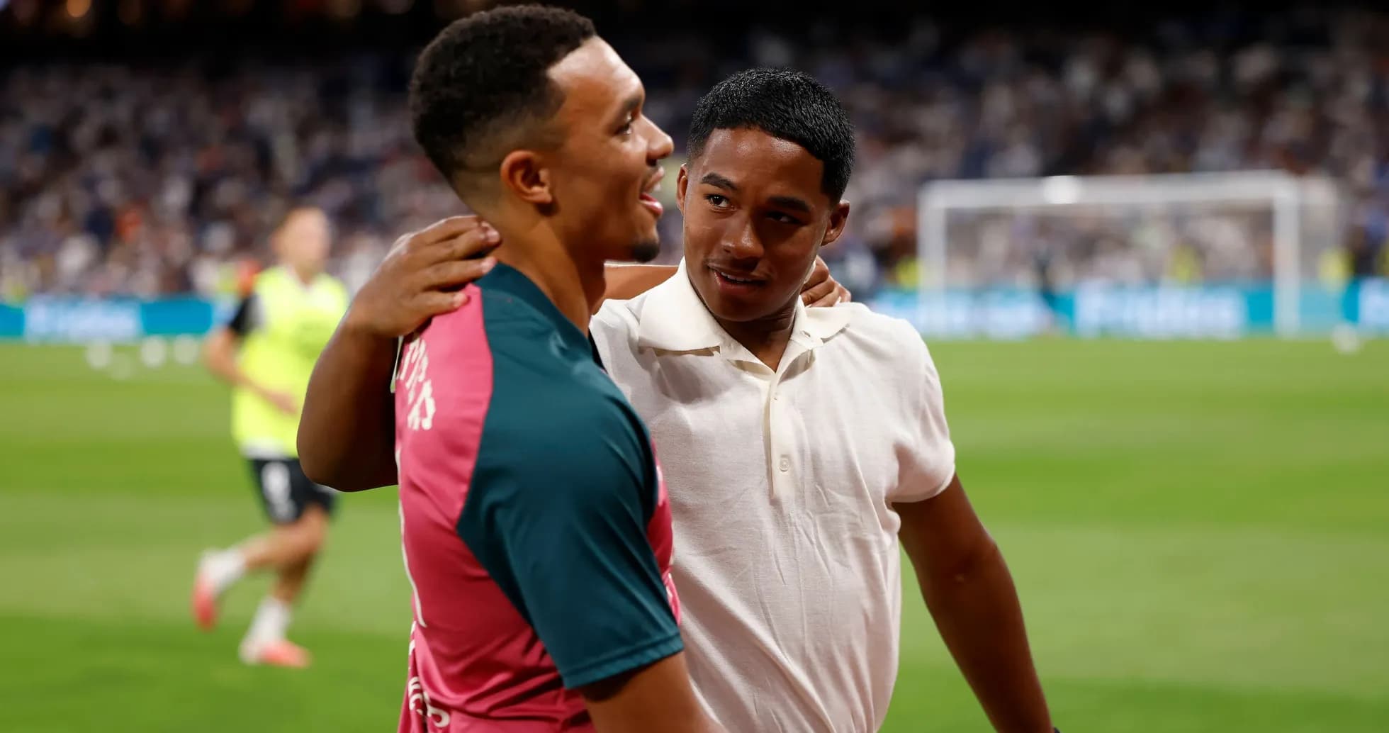 Two players sharing a moment on the field Two players sharing a moment on the field
