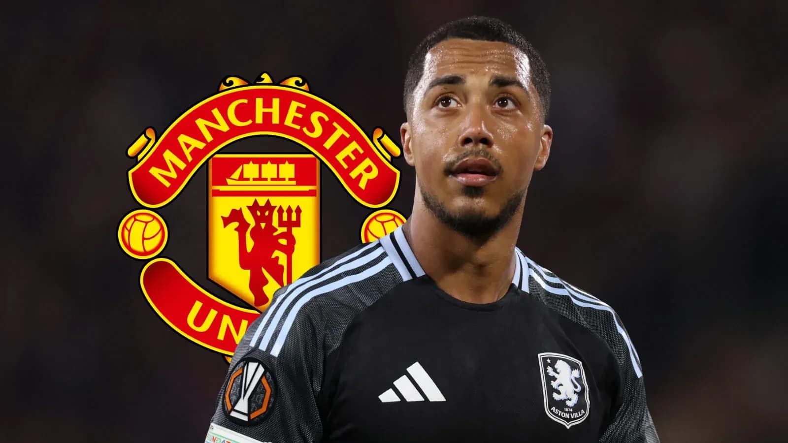 Aston Villa player in front of Manchester United logo Aston Villa player in front of Manchester United logo