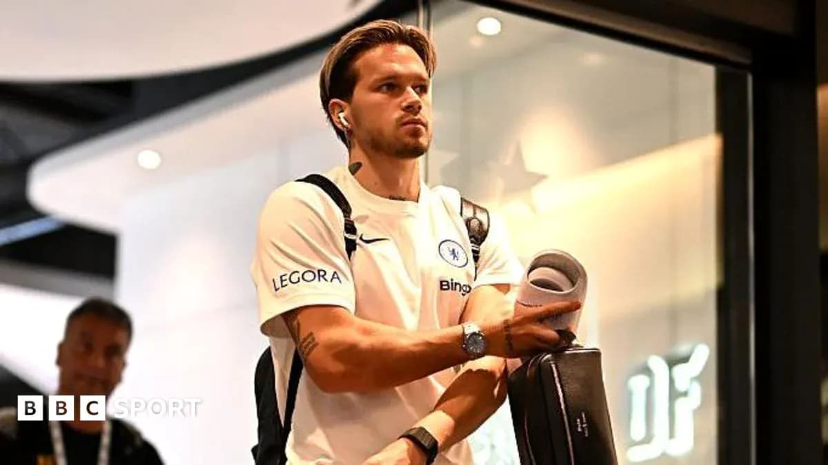 Player arriving at venue with bag and headphones Player arriving at venue with bag and headphones