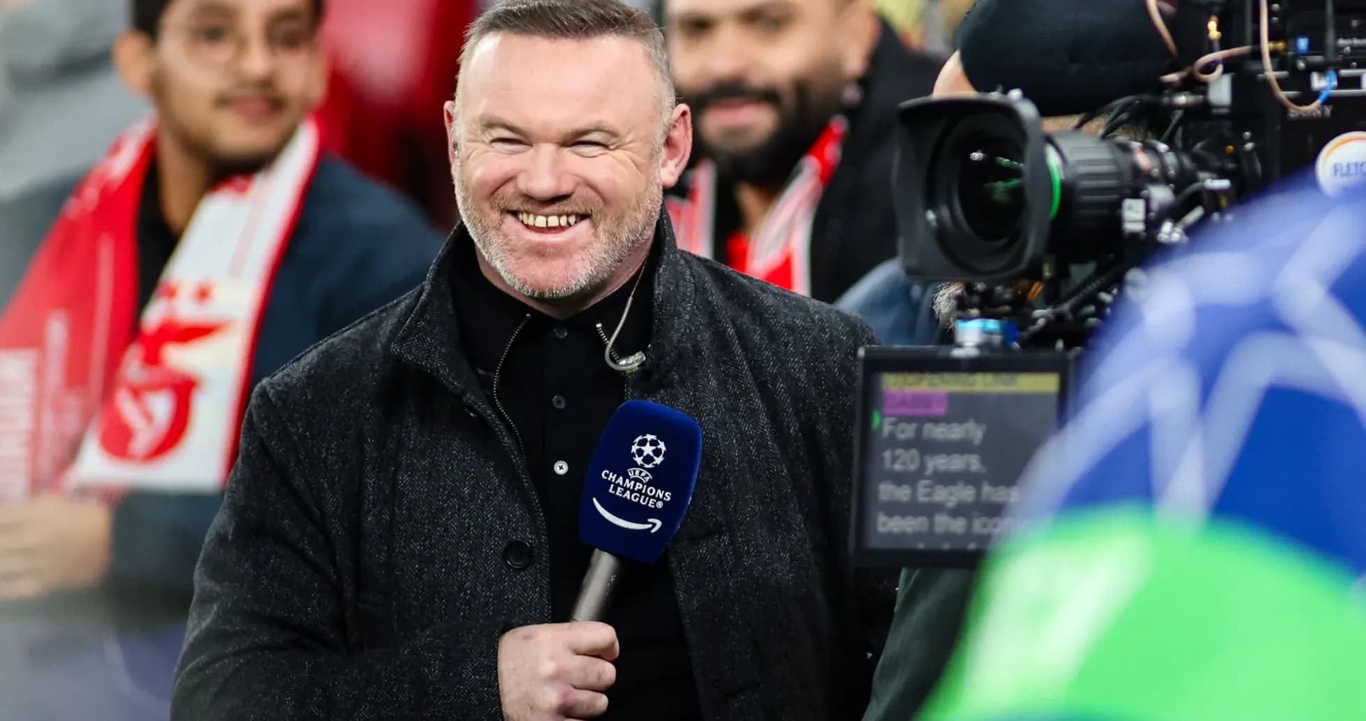 Presenter smiling with microphone before match Presenter smiling with microphone before match