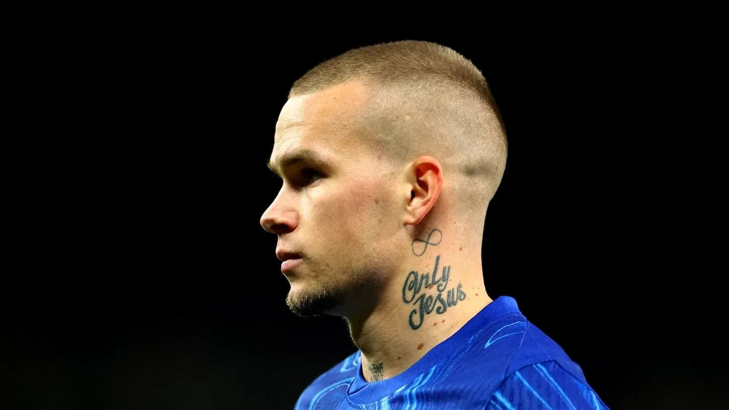 Player in blue jersey with neck tattoos Player in blue jersey with neck tattoos