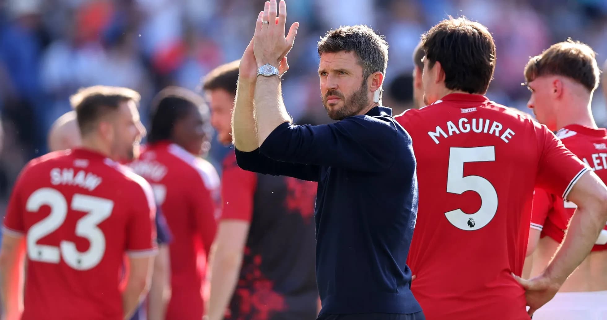 Manager applauding players after the match Manager applauding players after the match