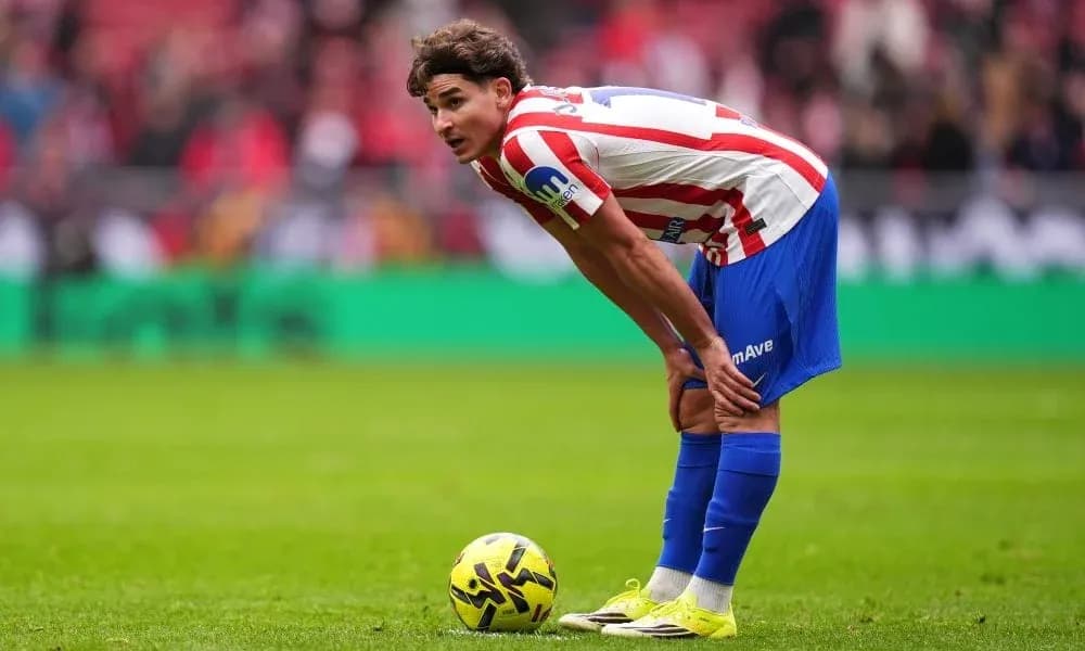 Player preparing to take a free kick on field Player preparing to take a free kick on field