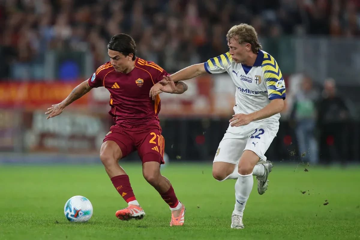 Player from AS Roma dribbling past Parma defender Player from AS Roma dribbling past Parma defender