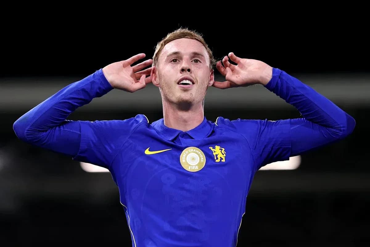 Player celebrating with hands to ears in blue jersey Player celebrating with hands to ears in blue jersey