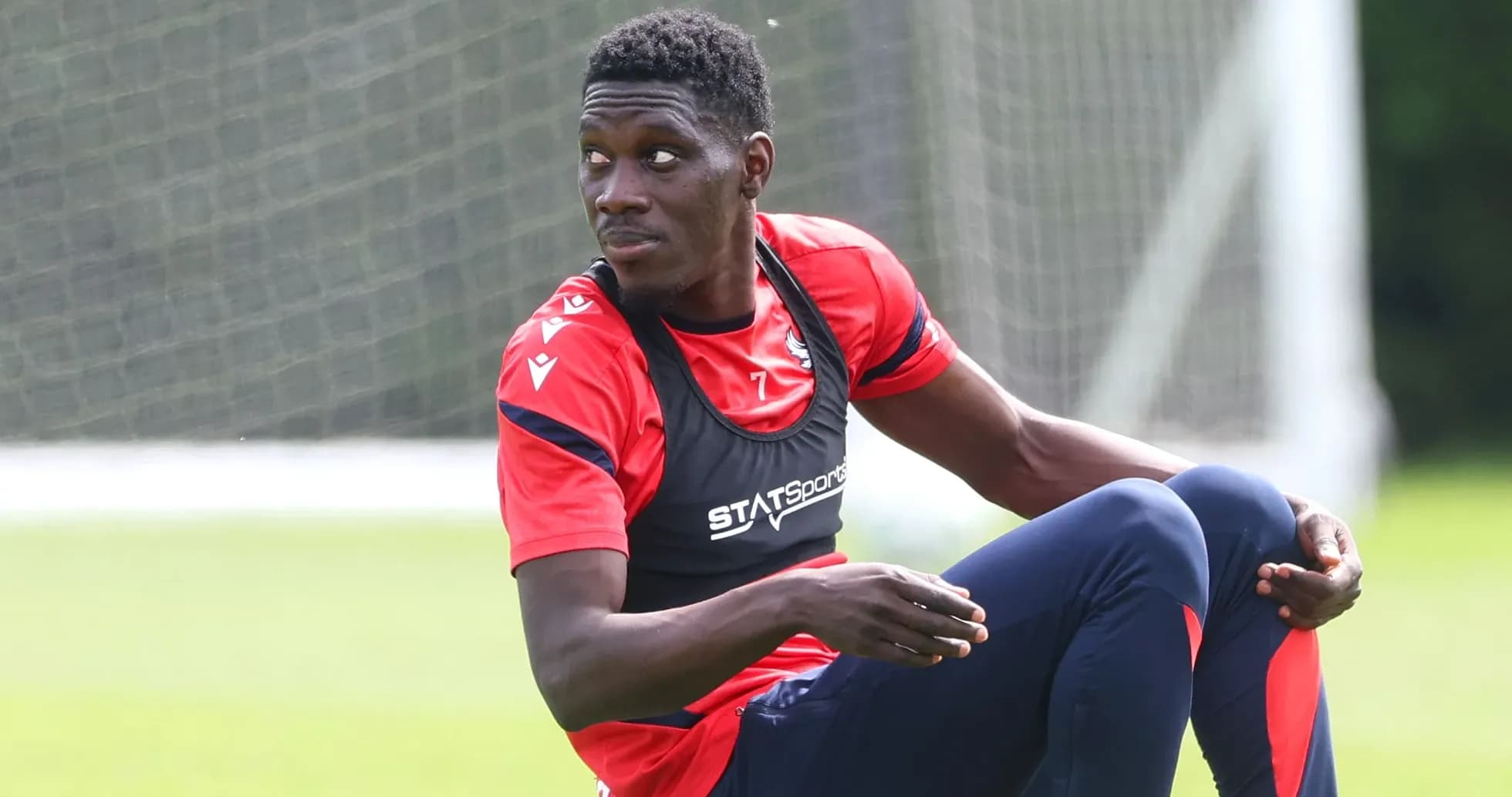 Player sitting during training session on field Player sitting during training session on field