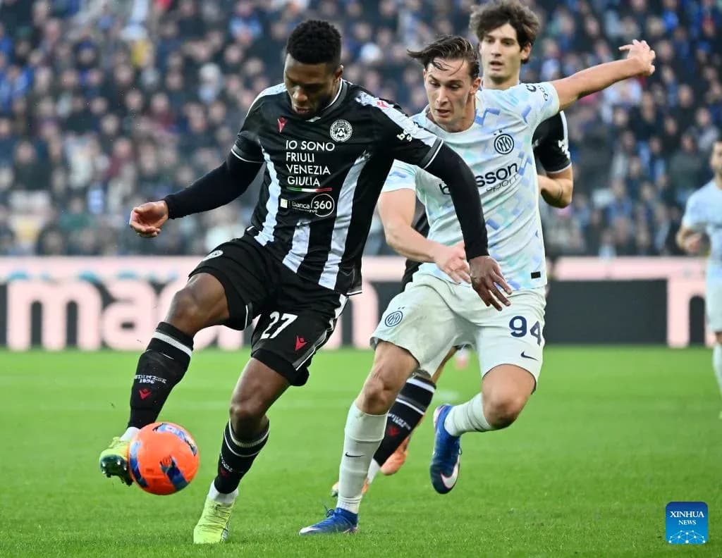 Player from Udinese dribbling past Inter defender Player from Udinese dribbling past Inter defender