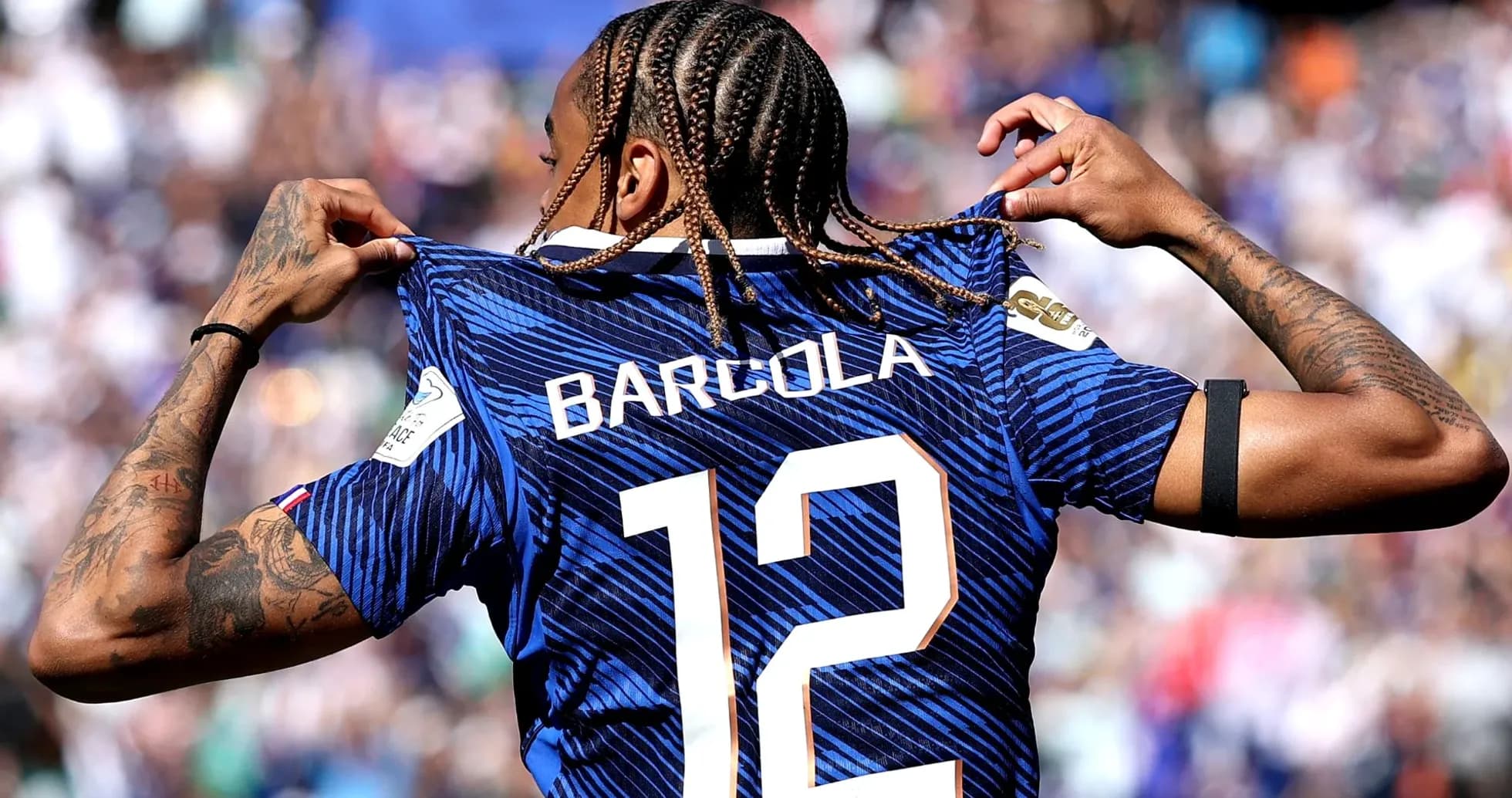 Player revealing jersey with 'BARCOLA' and number 12 Player revealing jersey with 'BARCOLA' and number 12