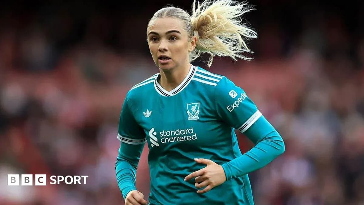 Player running in Liverpool FC kit during match Player running in Liverpool FC kit during match