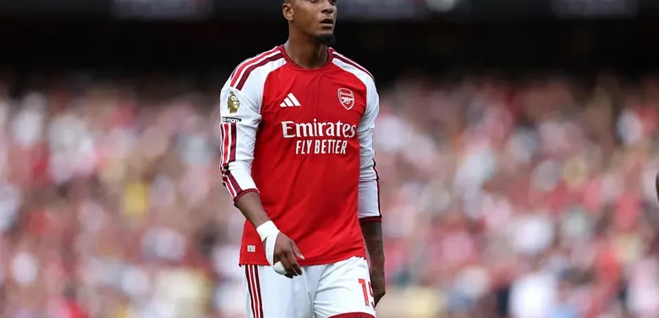 Player in Arsenal kit on the field Player in Arsenal kit on the field