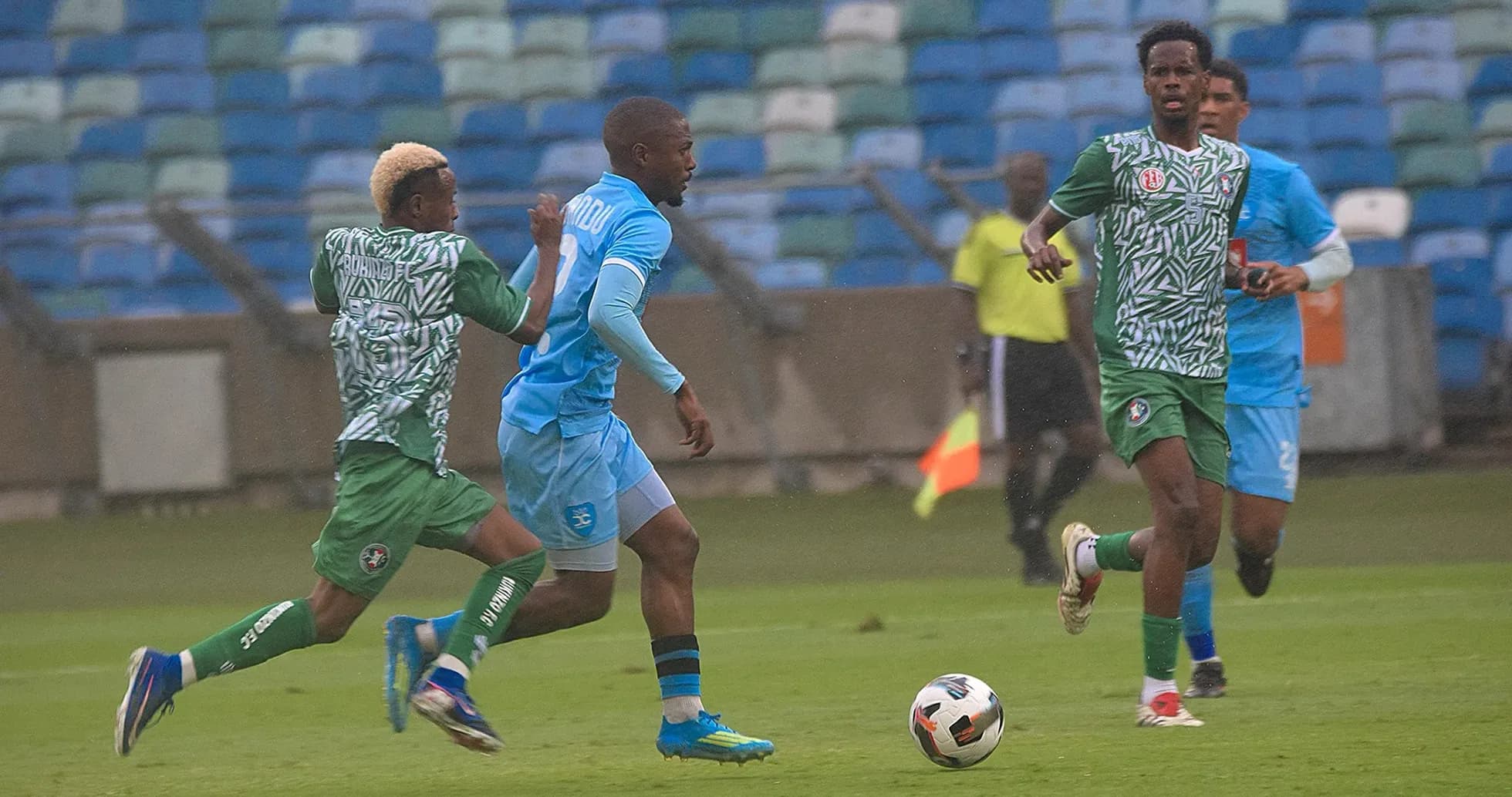 Players competing for the ball during CAF match Players competing for the ball during CAF match