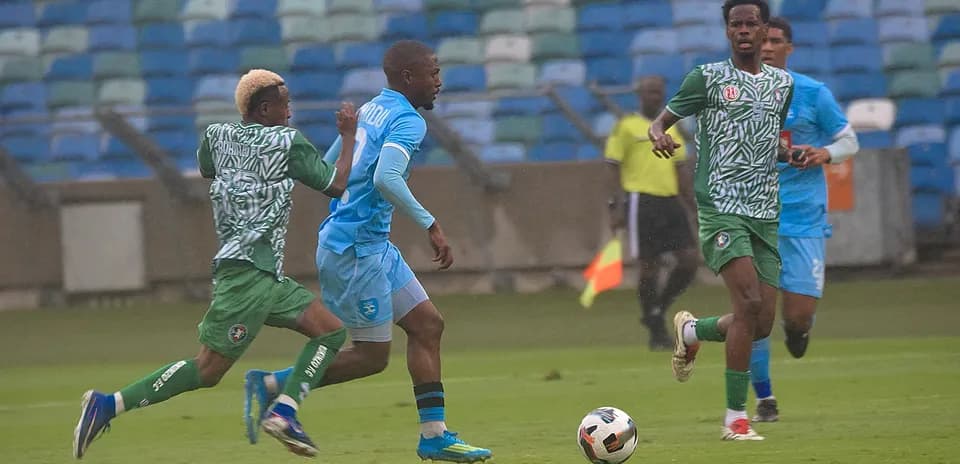 Players competing for the ball during CAF match Players competing for the ball during CAF match