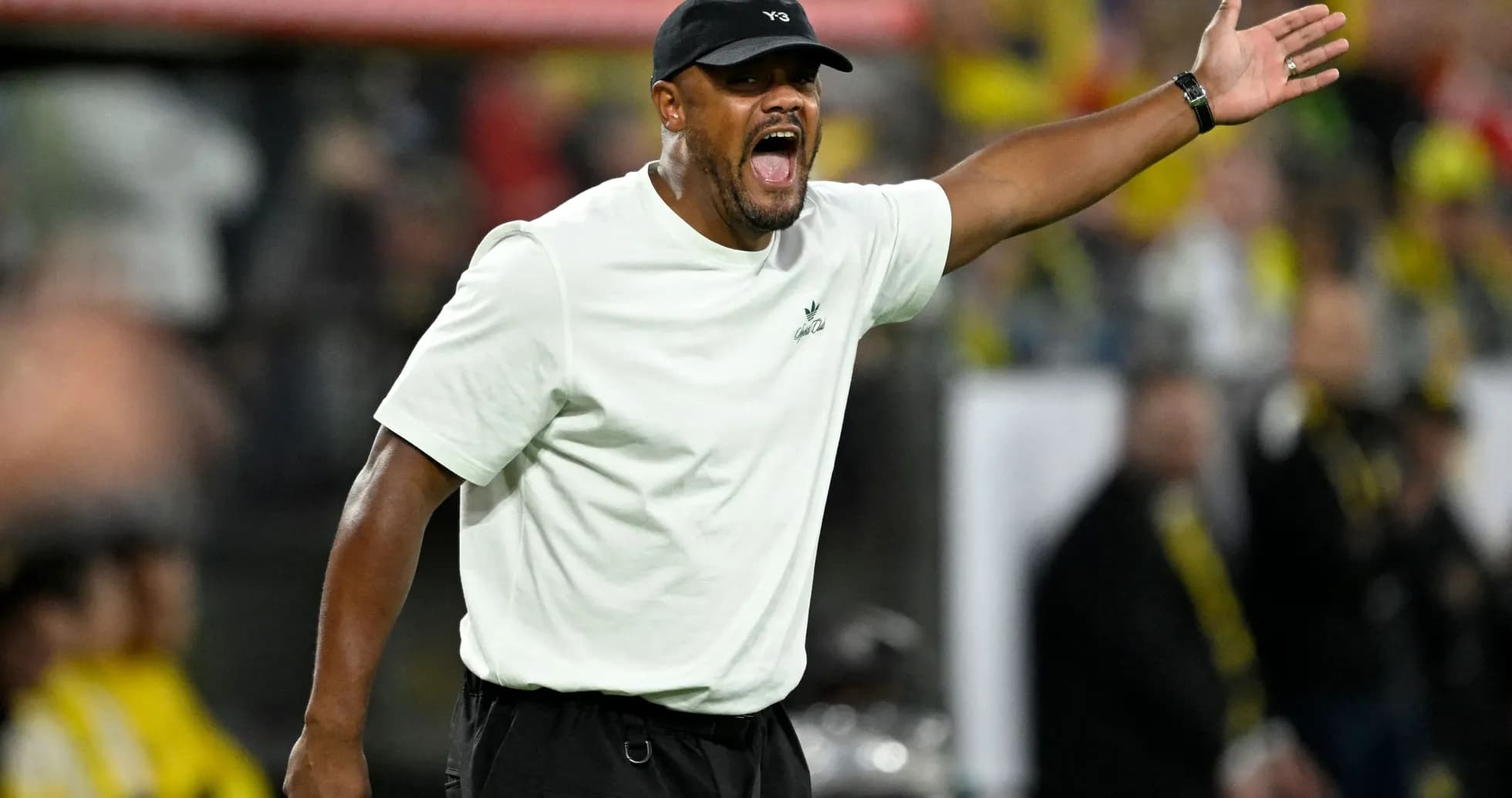 Coach gesturing during a match on the sidelines Coach gesturing during a match on the sidelines