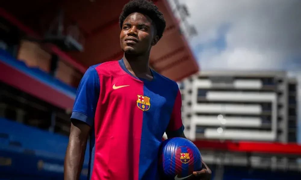 Player in Barcelona kit holding a football Player in Barcelona kit holding a football