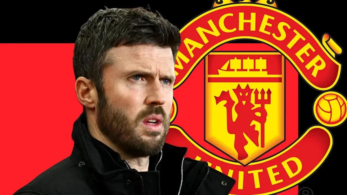 Coach in front of Manchester United logo Coach in front of Manchester United logo