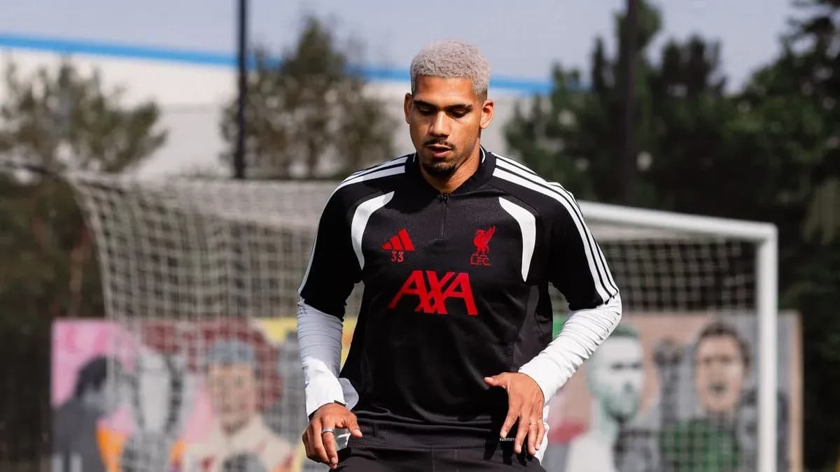 Player training on pitch wearing Liverpool kit Player training on pitch wearing Liverpool kit