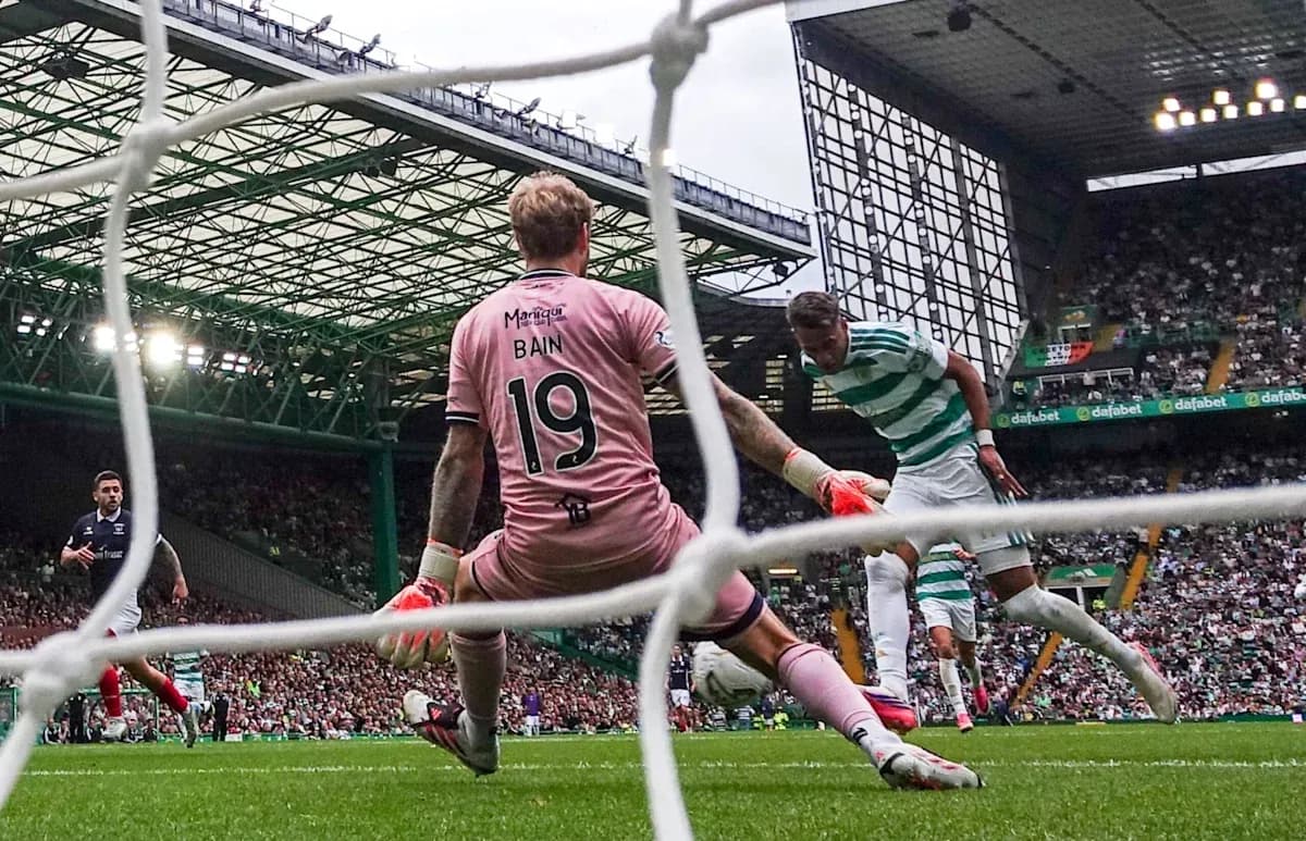 Celtic player attempting to score against goalkeeper Bain Celtic player attempting to score against goalkeeper Bain